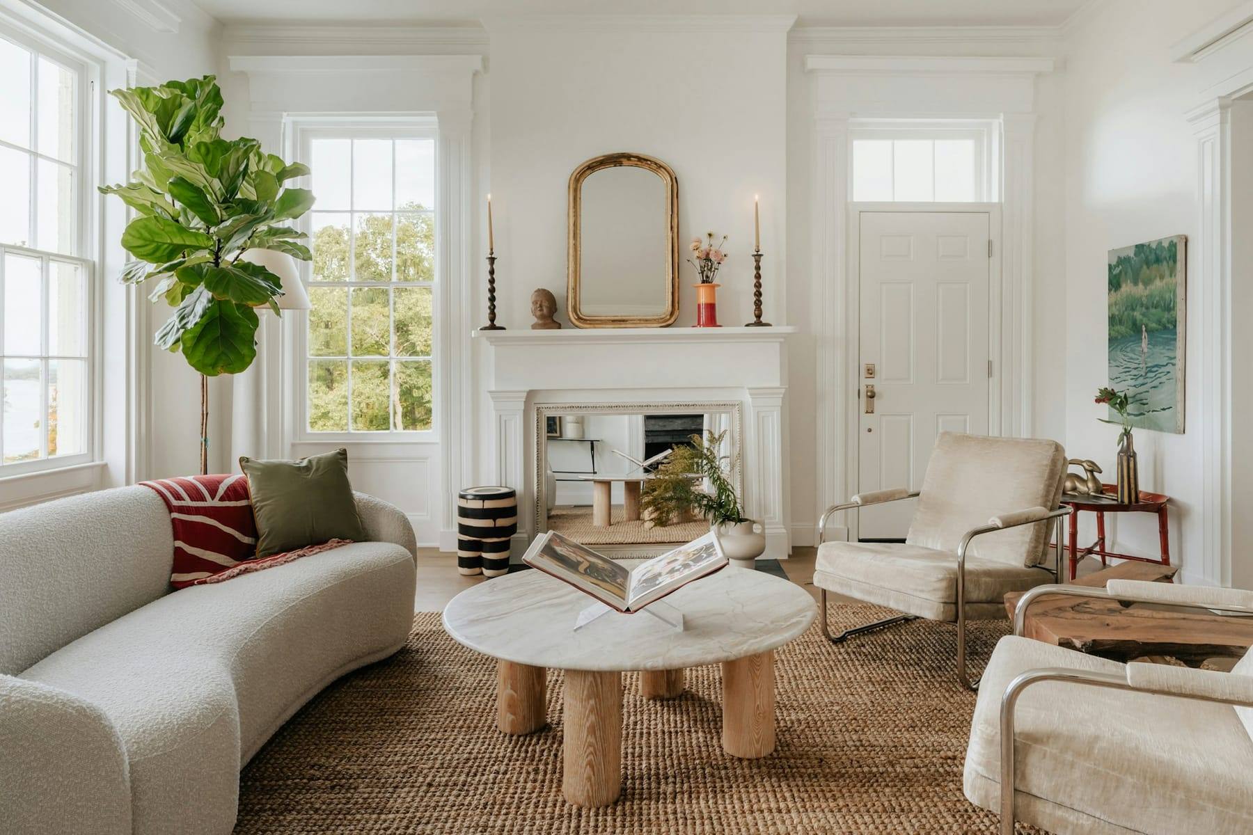 Bright living room with a curved sofa and a round coffee table